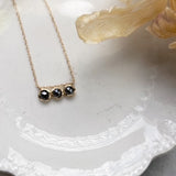 black diamond three stone necklace